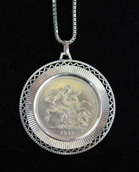 A GEORGE V GOLD FIVE POUND PIECE 1911 in pierced