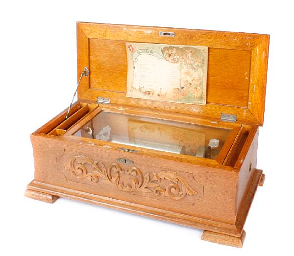 A Jacot s Swiss music box in a carved oak