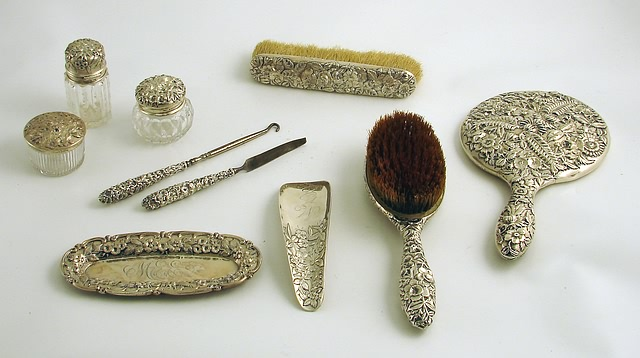 Primarily by S Kirk Son consisting of hand mirror hairbrush