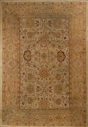 AGRA CARPET The tan field with floral vinework overlay within