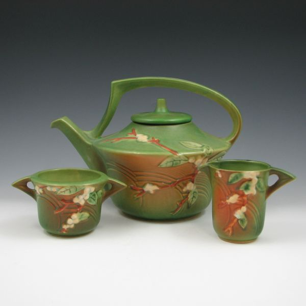 Three piece Roseville green Snowberry tea set including creamer sugar