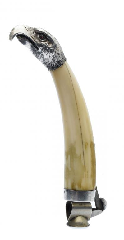 A CONTINENTAL SILVER MOUNTED BOAR S TUSK CIGAR CUTTER the