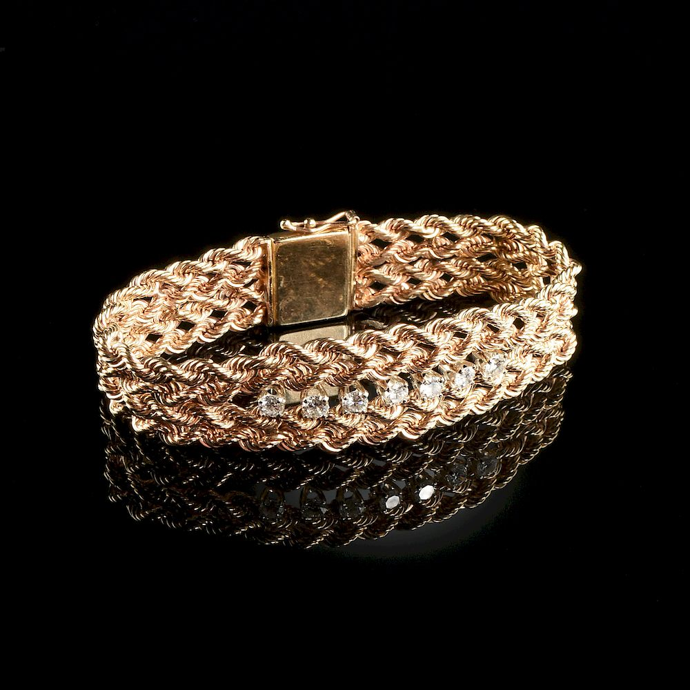 A 14K YELLOW GOLD AND DIAMOND LADY S BRACELET A