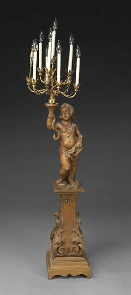 A Continental gilt metal mounted and carved pine floor torch