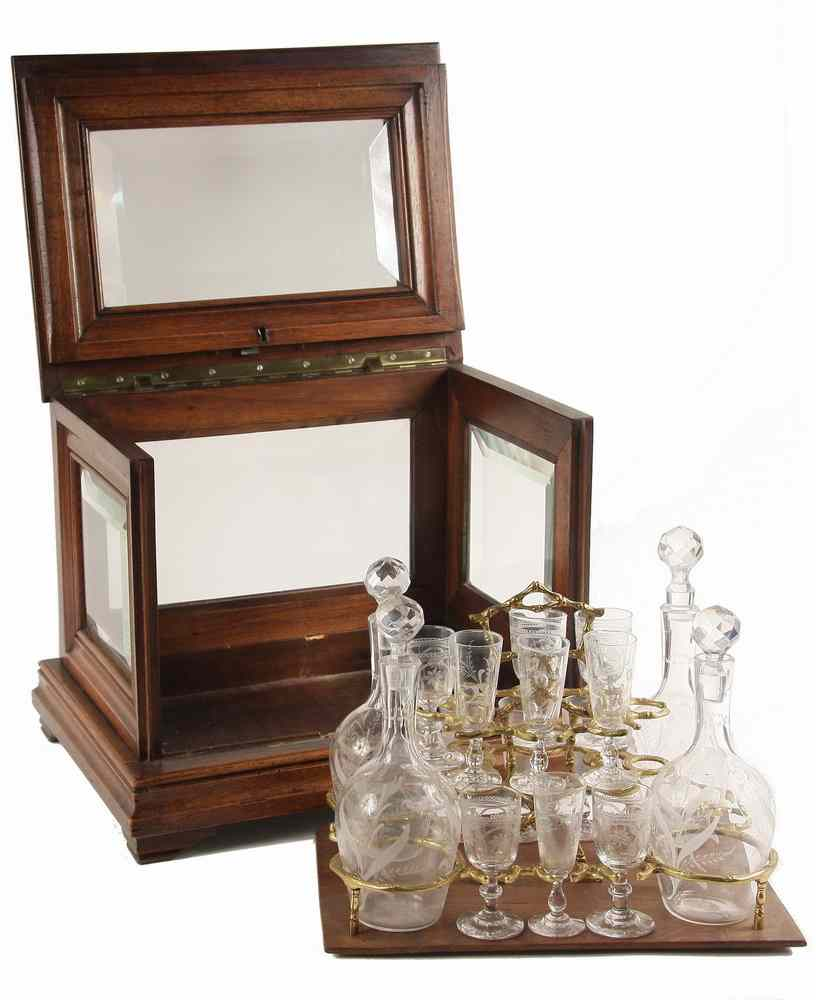 CASED LIQUOR TANTALUS Mahogany and Beveled Glass Locking Case containing