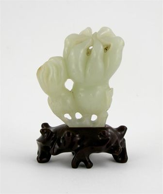 A Chinese pale celadon jade carving of two finger citron