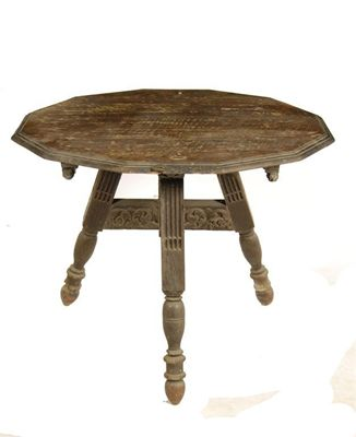 A carved oak folding tripod table the dodecagonal moulded edge