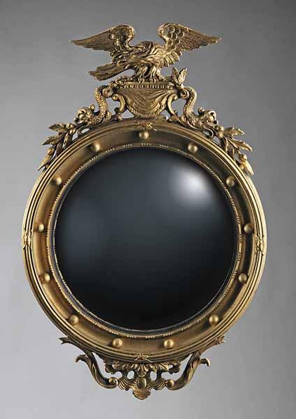A Federal Revival Giltwood Bullseye Mirror c 1900 the crest