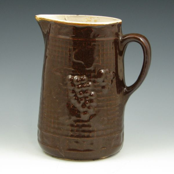 Brown glazed stoneware pitcher with grapes and leaves Unmarked Two