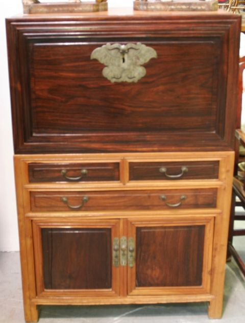 A Chinese chest on cabinet elm and blackwood top with