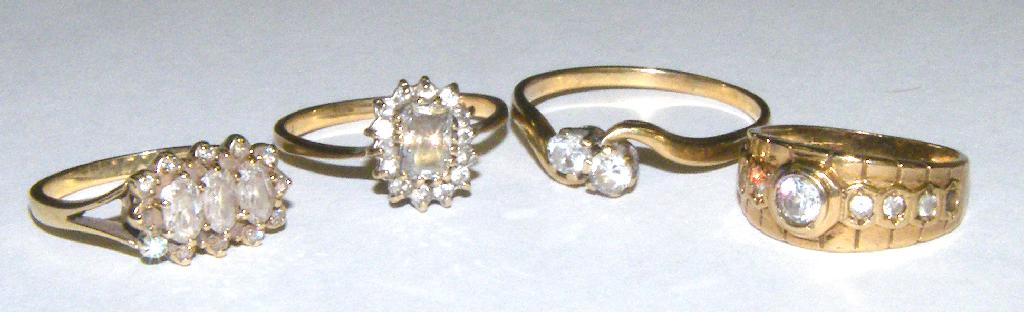 Four 9ct stone set ring 10 3gm