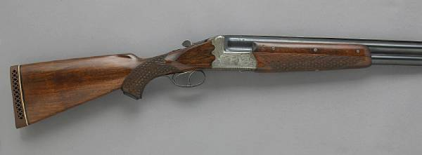 A 12 gauge Austrian guild boxlock o u shotgun Serial