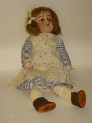 A Simon Halbig bisque character girl doll with blue glass
