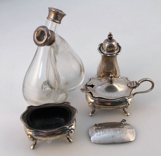 A Queen Elizabeth II silver cruet set comprising open salt