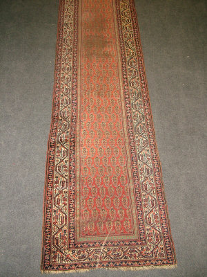 A Caucasian runner with rows of botehs in a brick