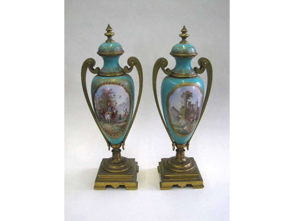 Pair of Sevres style ormolu mounted porcelain vases depicting men