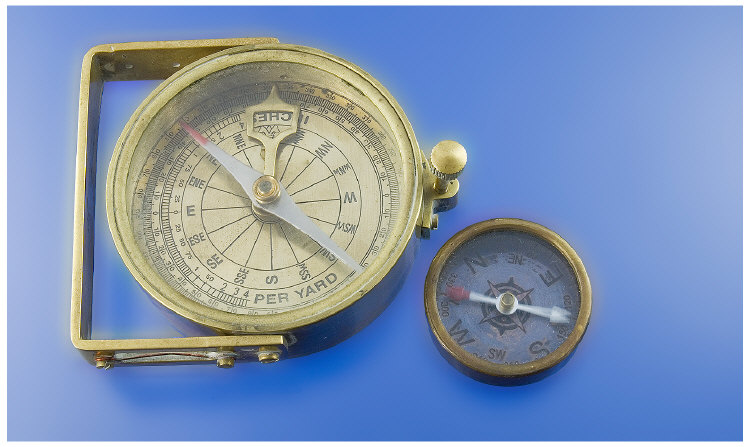 Two Brass Cased Compasses The larger one mounted on a