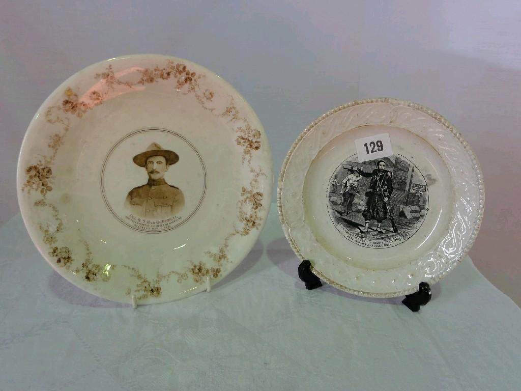 A 19th century plate with relief moulded scrolling border with
