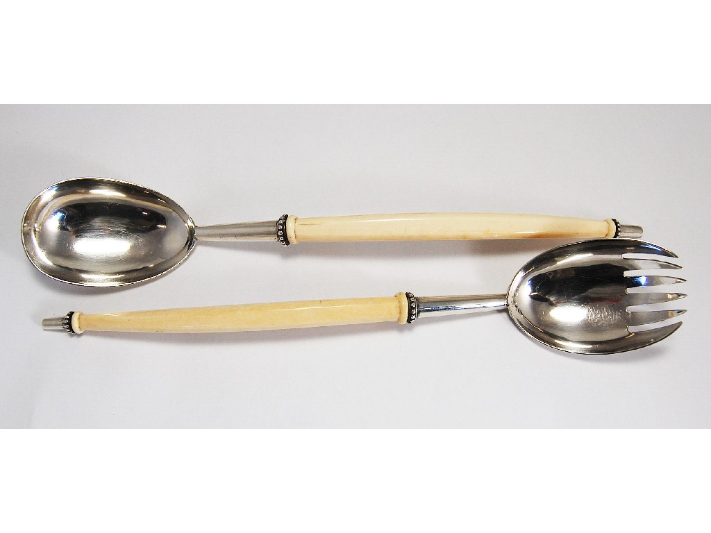 Pair of unusual Victorian salad servers having long curved ivory