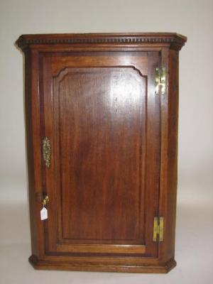 A GEORGE III OAK CORNER CUPBOARD 19th century with mahogany