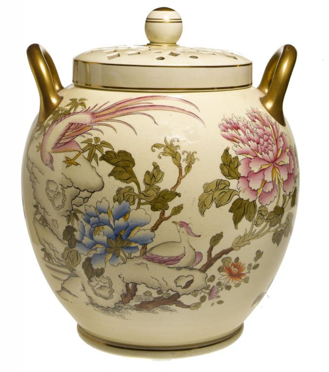 A WEDGWOOD YELLOW GLAZED EARTHENWARE GLOBE SHAPED POT POURRI JAR