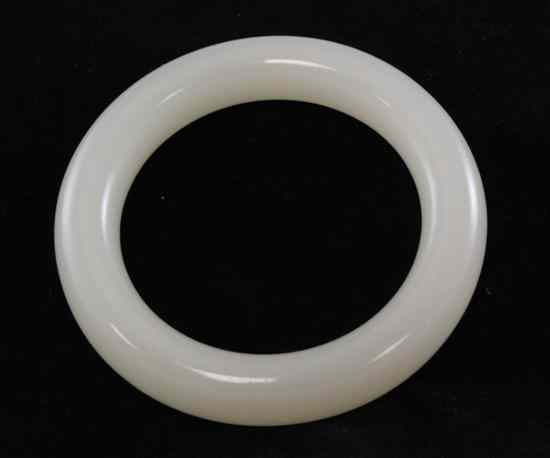 A Chinese bangle probably white jade 3 75ins Estimate 600