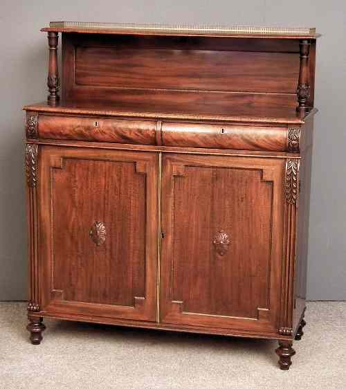 A William IV mahogany chiffonier the upper part with shelf