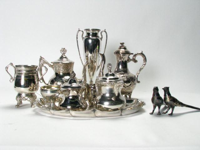 Large group of ornate silverplate including 12 handled pedestal vase