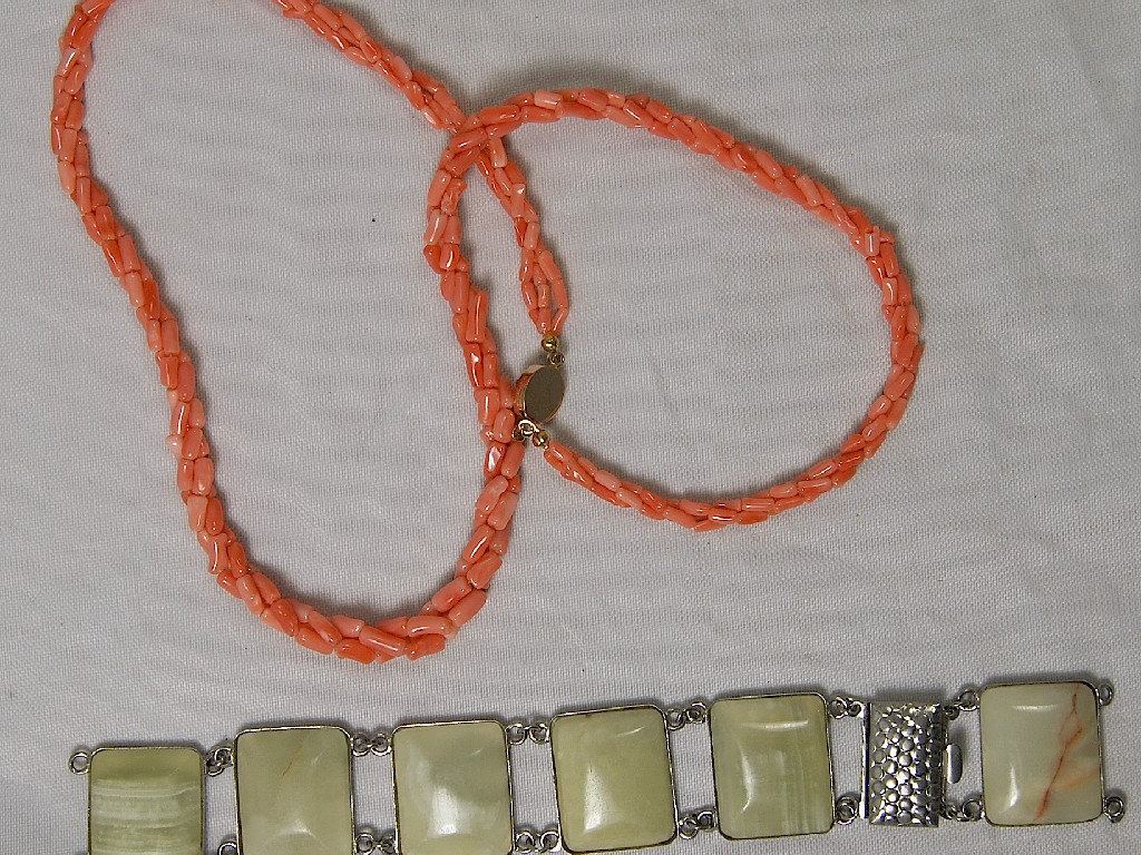 Triple row of coral beads to w onyx set bracelet