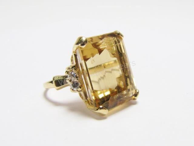 A 14K yellow gold ring with 17mm x 14mm emerald