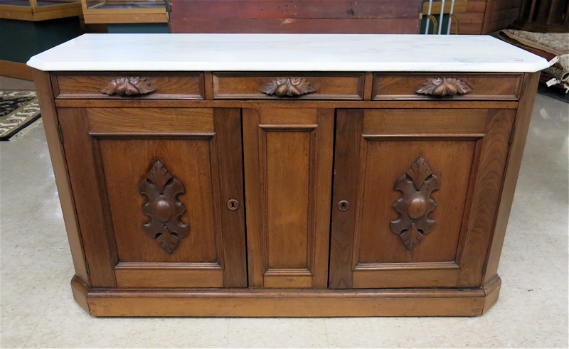 A VICTORIAN MARBLE TOP WALNUT BUFFET American last quarter of