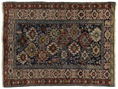 Shirvan rug repeating diagonal rows of stepped elements on blue