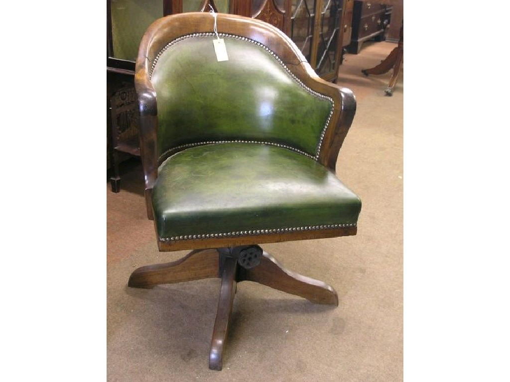 A mid Victorian mahogany framed office armchair tub shaped back