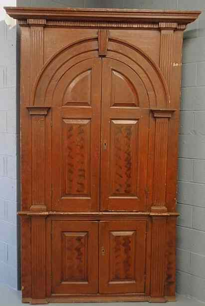 Pennsylvania pine architectural corner cabinet 18th c in two parts