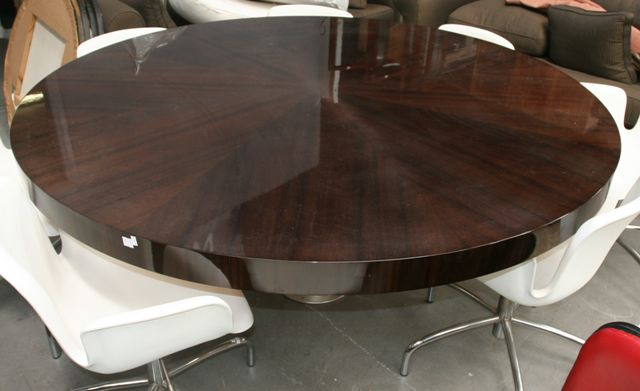 A walnut veneered and aluminium circular adjustable table by Metal