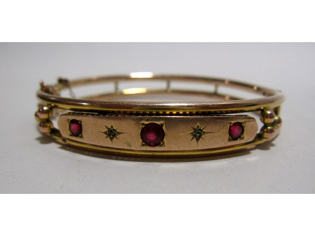 Victorian unmarked gold bangle set with rubies and diamonds