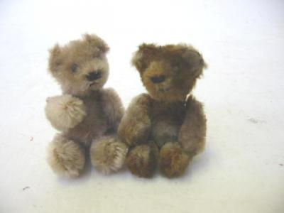 A Schuco miniature bear covered in beige plush with swivel