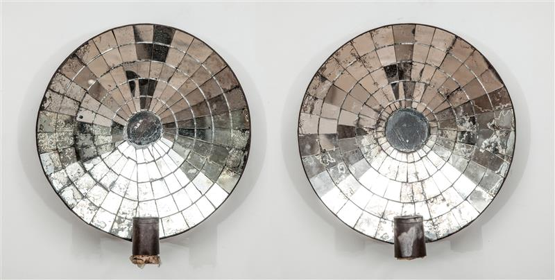 PAIR OF MIRRORED SCONCES Together with a stamped tin single
