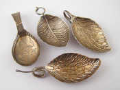 A Georgian caddy spoon with galleried rim and chequerboard handle