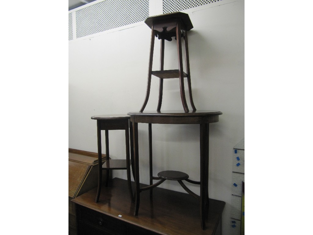 Two mahogany two tier occasional tables and a two tier