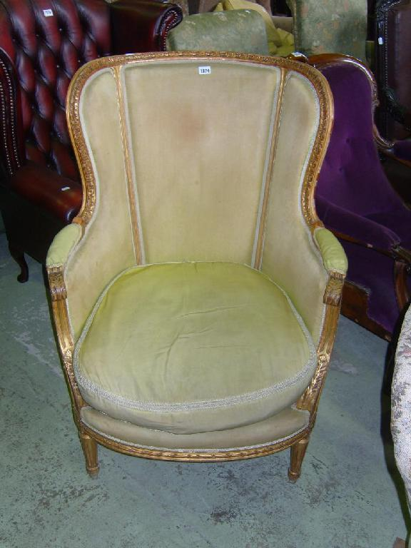 A continental salon armchair with scrolled arms square taper supports