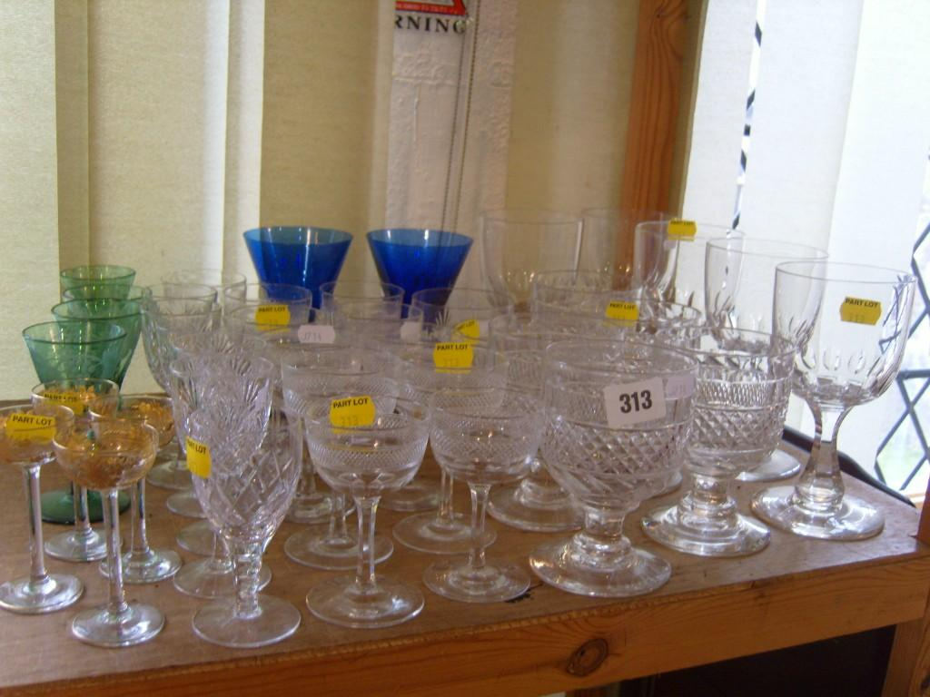A collection of drinking glasses including five rummers with hobnail