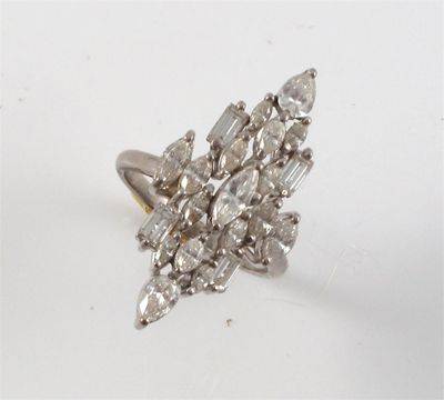 A diamond cluster ring set with marquise pear and baguette