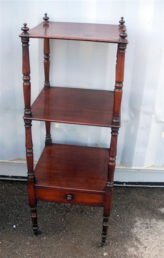 A 19th century mahogany three tier whatnot on turned supports