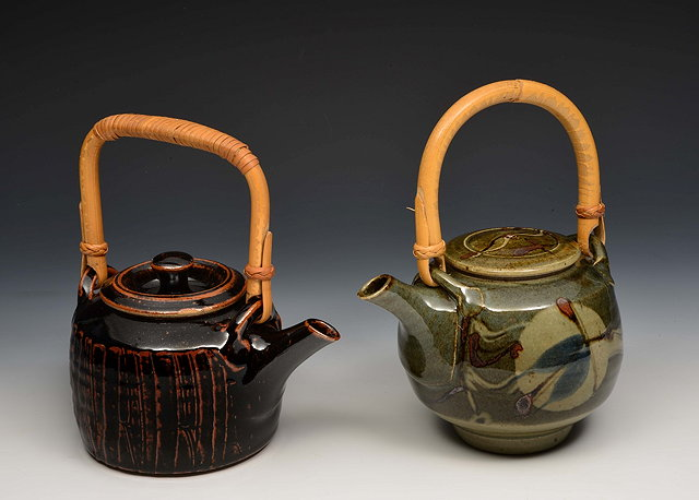 Peter Starkey British b 1945 Two teapotsone with fluted sides