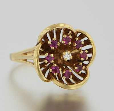 A Ladies Ruby and Diamond Flower Ring 14k yellow gold