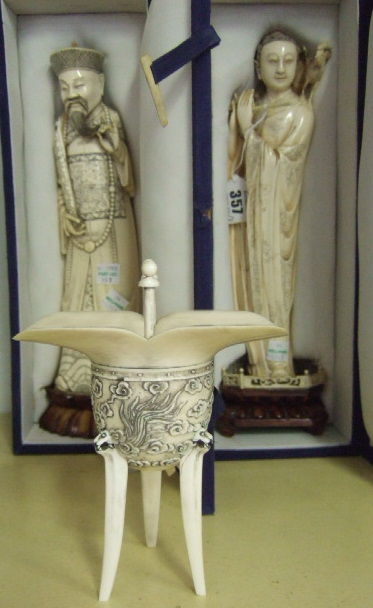 An ivory figure of a female musician 20th century carved