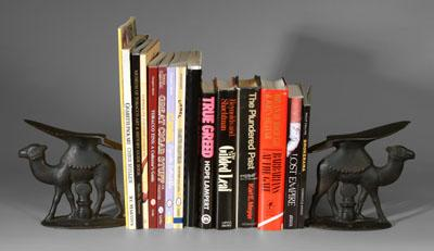 Pair camel foot rests 14 books pair cast iron camel
