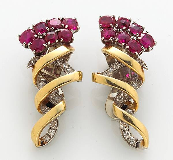 A pair of diamond and ruby earclips mounted in eighteen