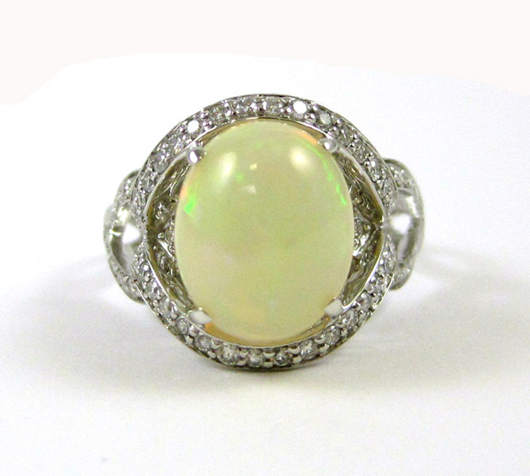 OPAL DIAMOND AND FOURTEEN KARAT GOLD RING The white gold